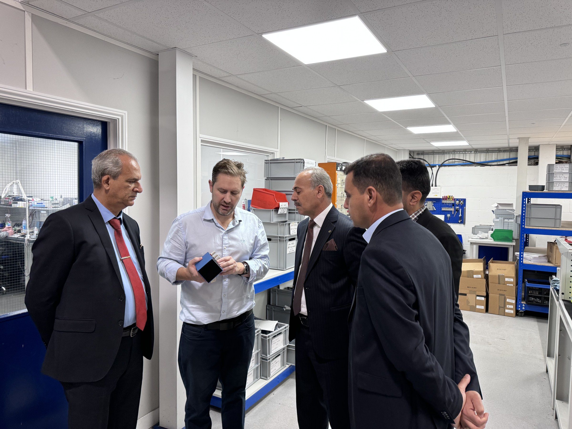 Robert Bailey showing the delegation around the Time Electronics factory.